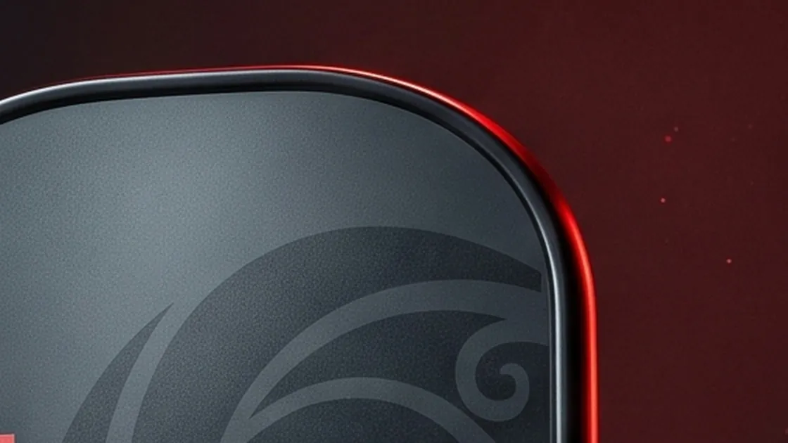 The rounded edge of the KORU paddle catching red light